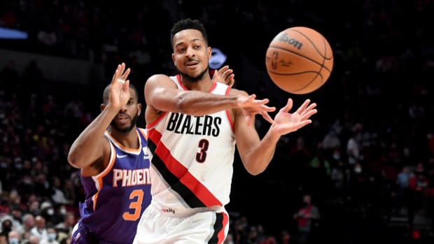 Oct 23, 2021; Portland, Oregon, USA; Portland Trail Blazers guard CJ McCollum (3) passes the ball on Phoenix Suns guard Chris Paul (3) during the second half of the game at Moda Center. Mandatory Credit: Steve Dykes-USA TODAY Sports